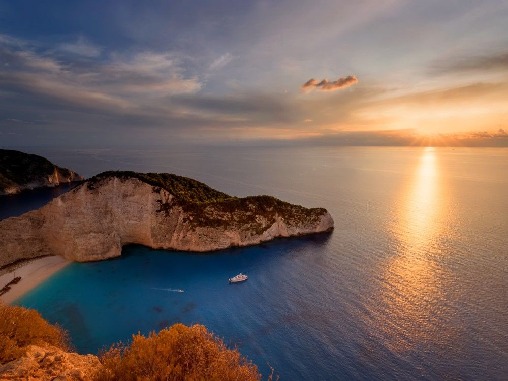 image presenting excursion Sunset Yacht Cruise to Shipwreck Beach & the Blue Caves