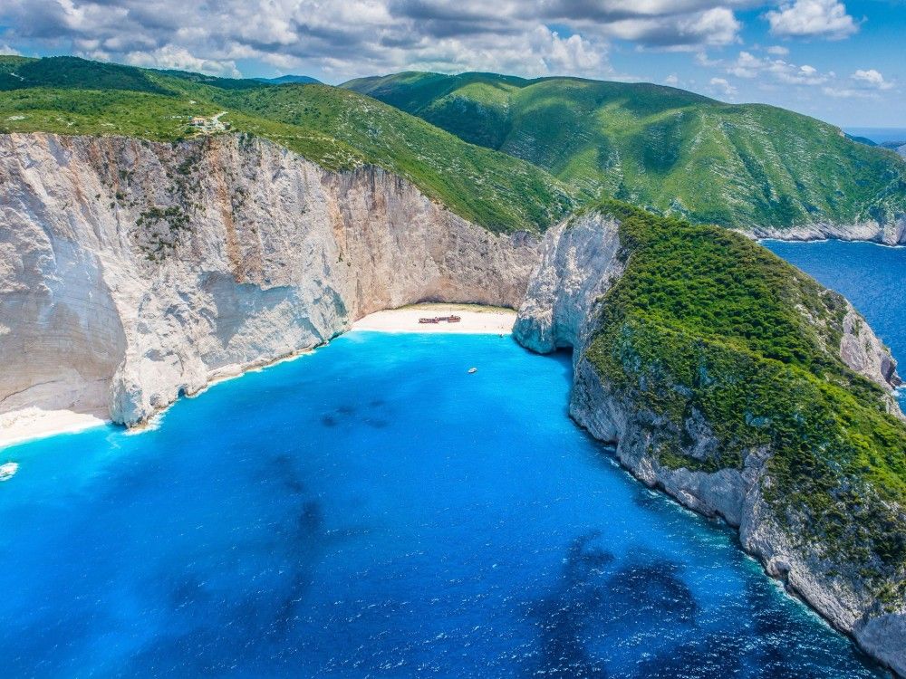 Celebrate Aboard a Luxury Yacht, Bound for Shipwreck Beach & the Blue Caves