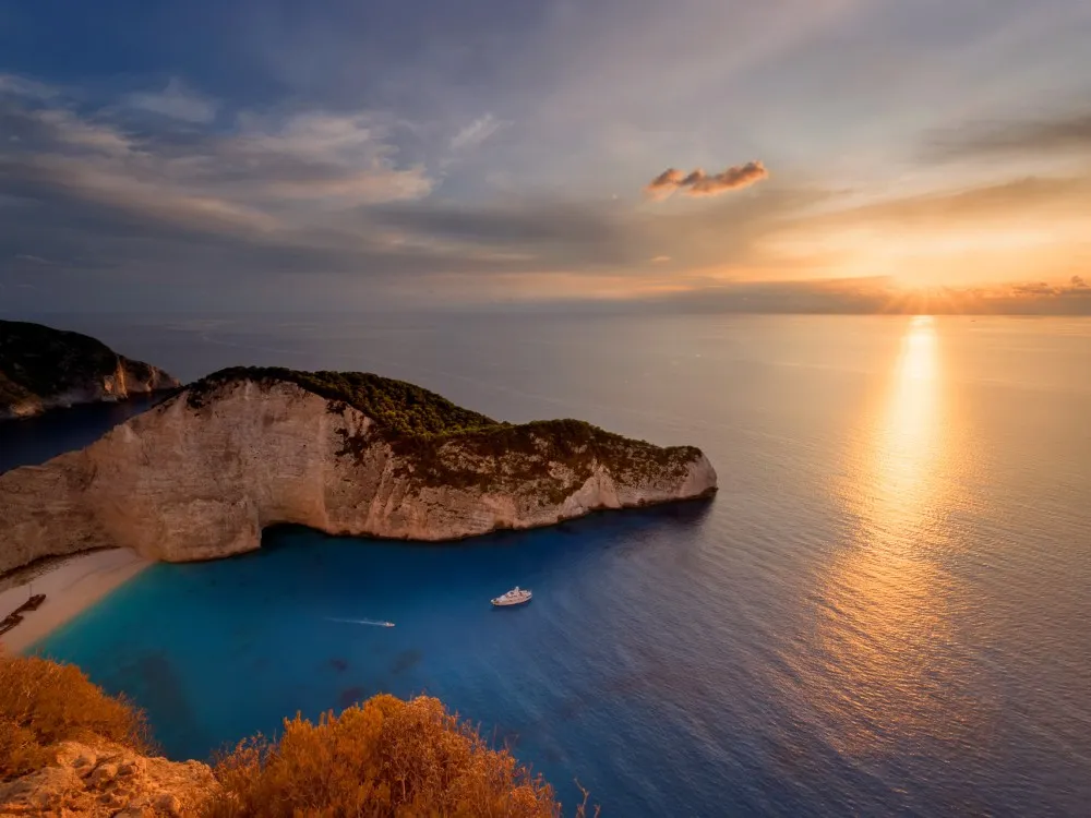 Excursion Sunset Yacht Cruise to Shipwreck Beach & the Blue Caves